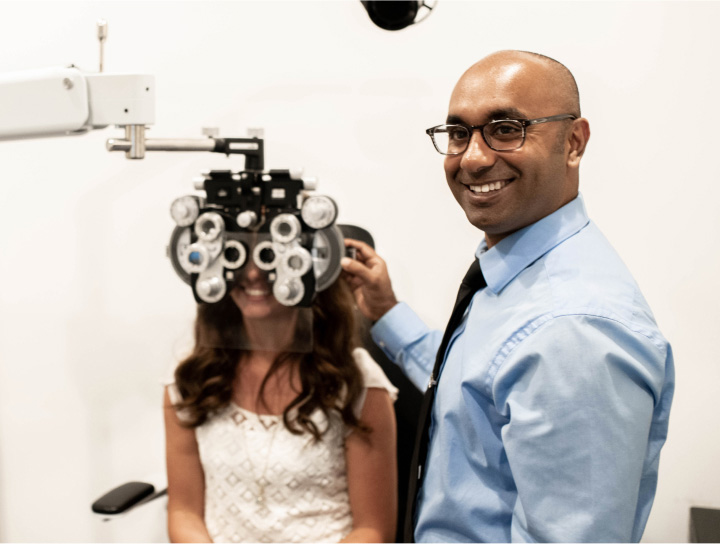 Dr. Lillie with a patient at Family Vision Optical