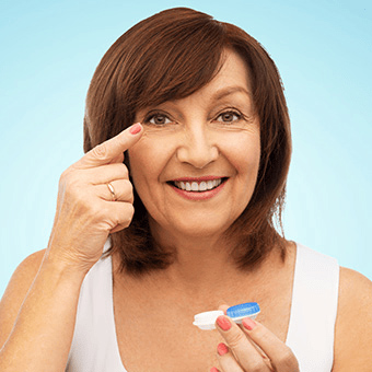 Middle-age woman getting ready to put her contacts at FVO