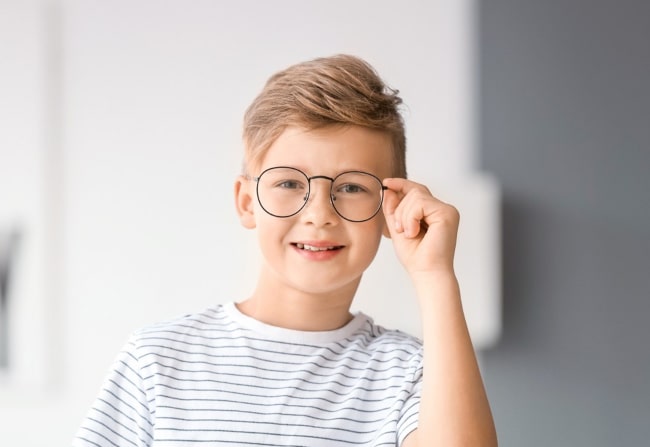 Kid wearing eyeglasses at Family Vision Optical