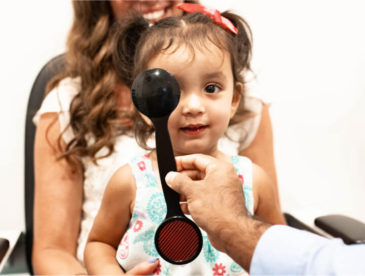 Child getting an eye exam at Family Vision Optical