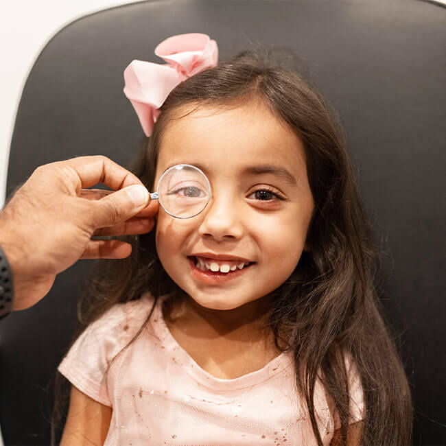 Young child getting an eye check at Family Vision Optical