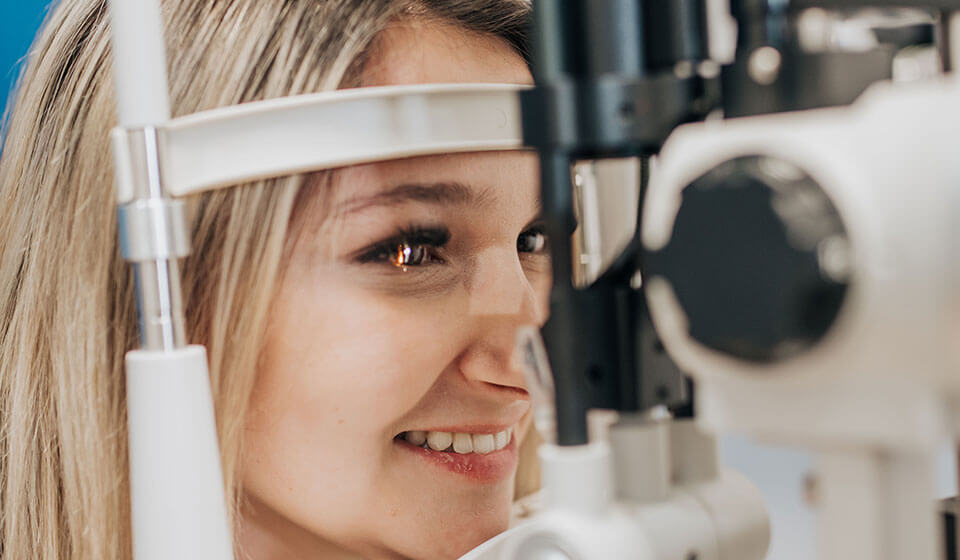 Woman getting an eye exam at Family Vision Optical