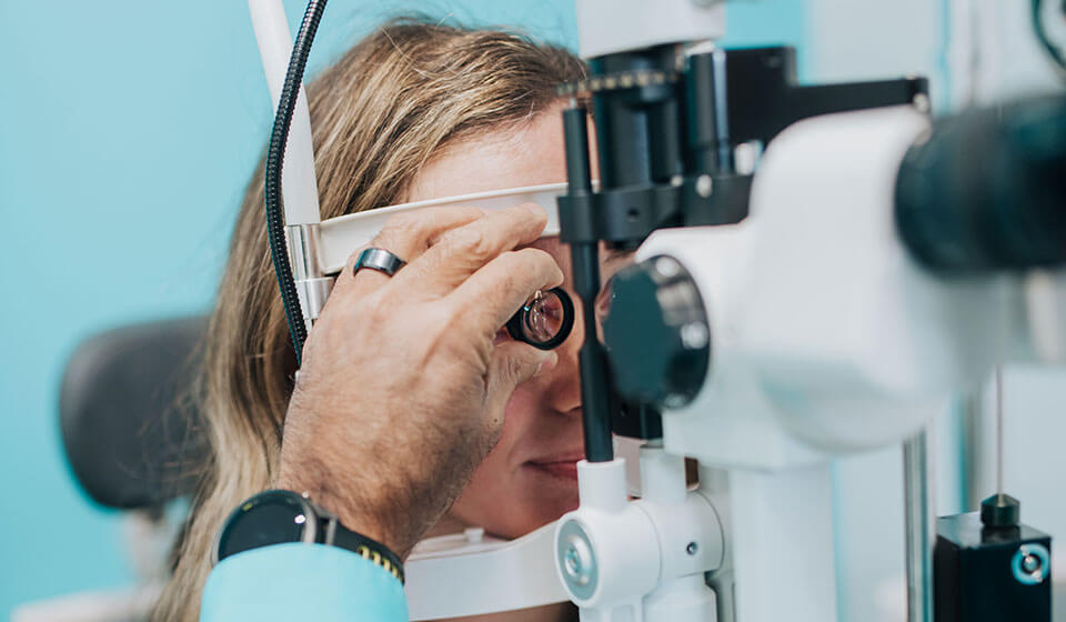 Woman getting a contact lens exam at Family Vision Optical