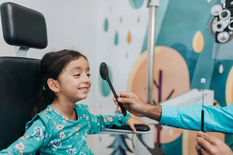 Child getting a pediatric eye exam at Family Vision Optical