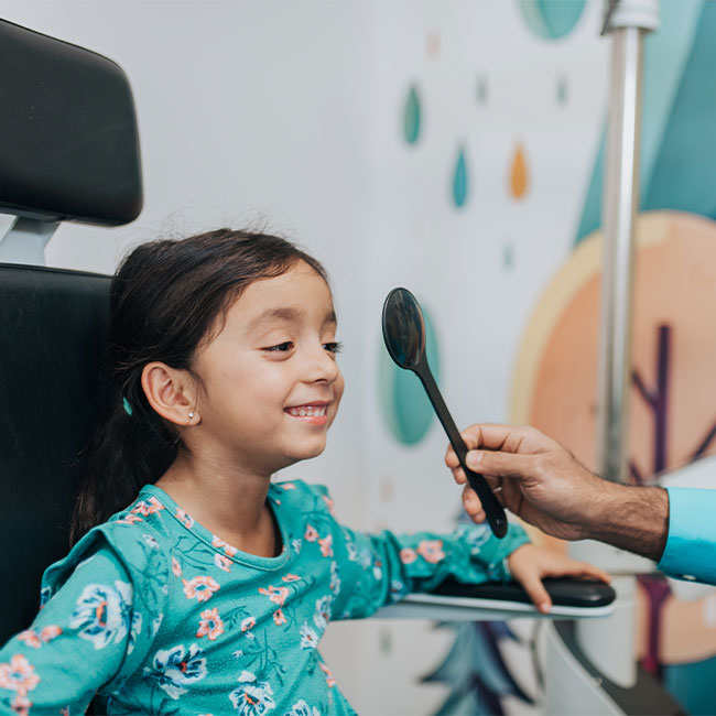 Young child getting an eye check at Family Vision Optical